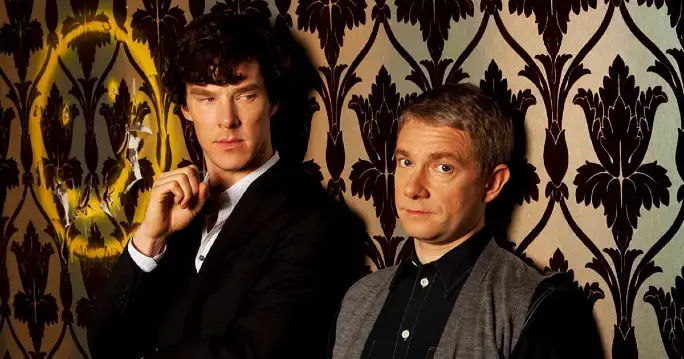 Benedict Cumberbatch and Martin Freeman in character on set in the BBC's Sherlock tv show